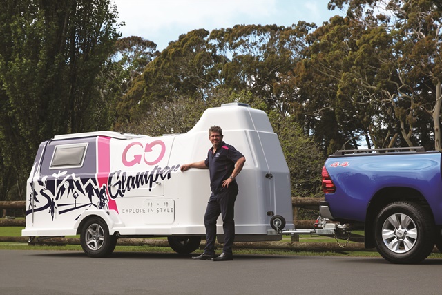 James Dalglish, general manager at GO Rentals in New Zealand, poses with the GO Glamper camper trailer. “This is an excellent diversification for GO in a highly competitive market,” he says. Photo courtesy of GO Rentals.