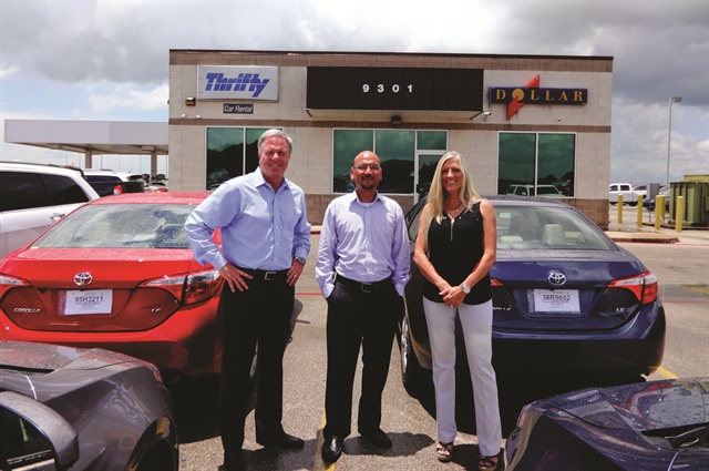 Working with several lenders, including 1st Source Bank, has helped Monty Merrill (left) expand his fleet at his Dollar Thrifty franchise locations. Merrill is pictured with Danny Owens, city manager, and Rene Mitchell, director of administration, at the Austin service center. 