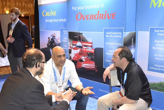 Car rental attendees interacted with vendors in the exhibit hall.